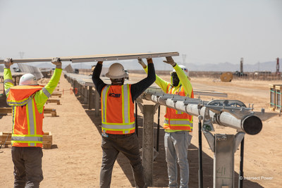 Construction workers installing panels at Intersect Power’s Athos III solar + storage project in Riverside County, CA. The 224 MWac project has created more than 450 jobs and is expected to be online by the end of 2022.