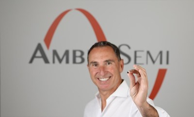 AmberSemi's CEO & Founder, Thar Casey, holding an AmberSemi AC Direct DC Enabler Chip