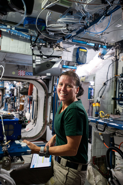 SpaceX Crew-1 Mission Specialist and Expedition 64 Flight Engineer Shannon Walker of NASA installs an airborne particulate monitor in the Tranquility module during her first week aboard the International Space Station.