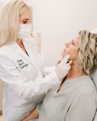 Rachel Gill, Expert Injector at The Skin Center, discusses dermal fillers with her patient.