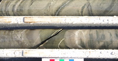 Figure 4: Great Pyramid diamond core (22GPDD008, 166.5m). Bedded sandstone with multiphase quartz-sulphide veins (sulphides dominated by arsenopyrite-pyrrhotite-chalcopyrite) associated with chlorite and sericite alteration. Diamond drill hole beneath historic resource area, assay results pending. (CNW Group/TinOne Resources Corp.)