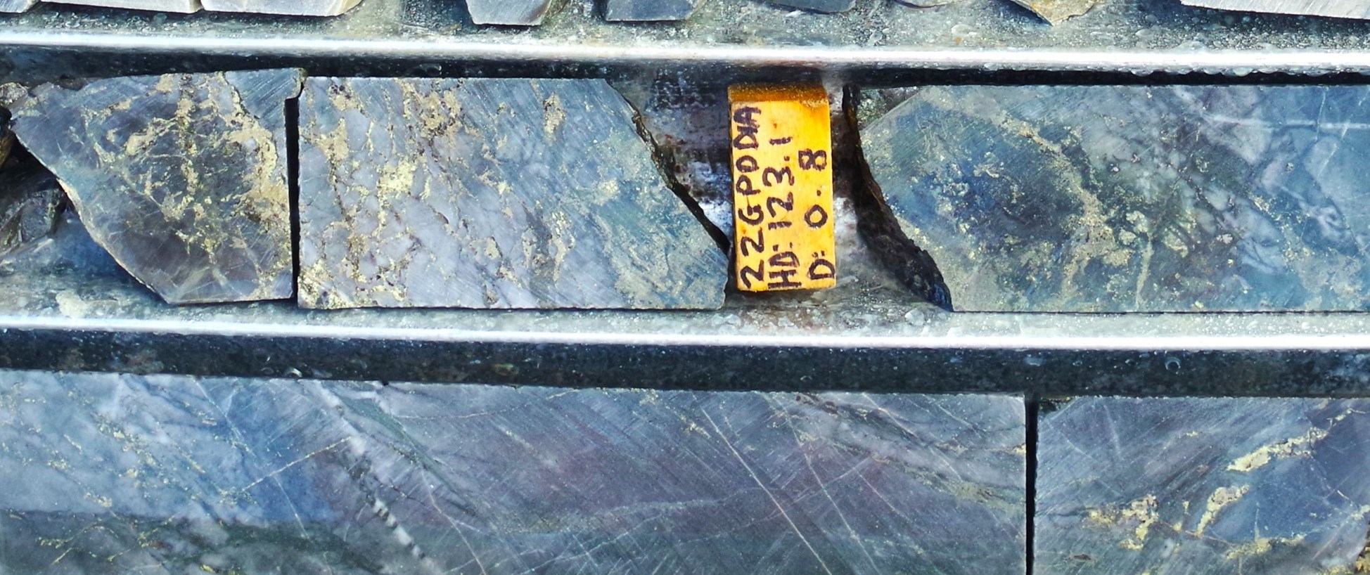 Figure 6: Great Pyramid diamond core (22GPDD001A, 123.1m). Strong chlorite-quartz alteration with abundant pyrrhotite-chalcopyrite-pyrite-magnetite veins and breccia.  Diamond drill hole beneath historic resource area, assay results pending. (CNW Group/TinOne Resources Corp.)