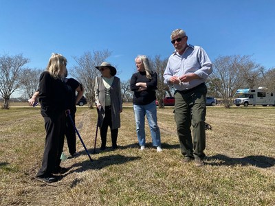FHD Forensics founder and genetic genealogist, Allison Peacock with the families of Dean and Tina Linn Clouse at the Harris County Cemetery in Houston where the couple is buried. Peacock and members of both families traveled to the wooded site of their 1981 discovery, as well as the graves in March this year to advocate for missing daughter Holly Marie Clouse and reinvigorating the cold case murder investigation. Holly, now 42, was miraculously discovered this month.
