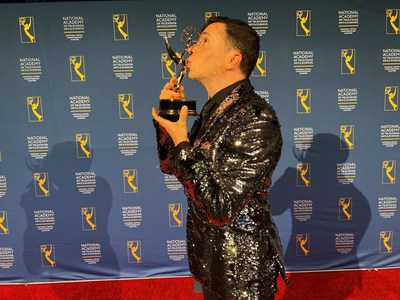 Yuval David kisses his trophy after winning his first Emmy Award at the Emmy Awards ceremony, hosted by the National Capital Chesapeake Bay Chapter.