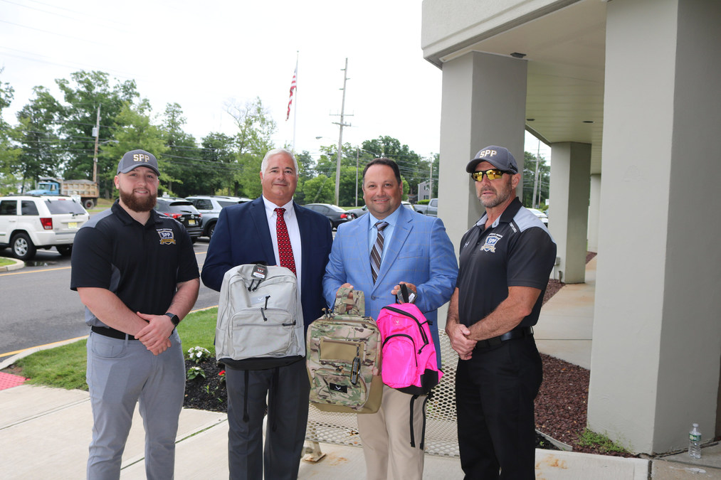 Bullet-Proof Backpacks Donated to School District by Security Guard Agency - Vimarsana News