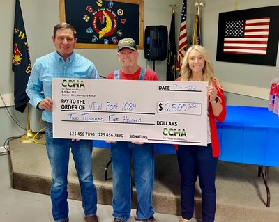 Chris Cobb (left) and Brooke Adams (right) of CCMA present a donation to Randall Jett (center) in support of the Kentucky Lake VFW Post 1084.
