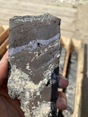 Photo 4. WPC22-07 - Massive Fe-rich sphalerite infilling clots of intergrown dolomite crystals in turn cut by veinlets of argentiferous galena (CNW Group/Western Alaska Minerals Corp.)
