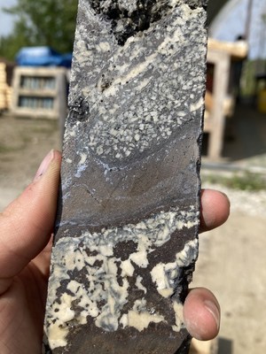 Photo 6. WPC22-07 - Multiphase massive Fe-rich sphalerite mineralization with zones of late argentiferous galena infilling a mat of dolomite crystals and crosscutting earlier massive sphalerite (CNW Group/Western Alaska Minerals Corp.)
