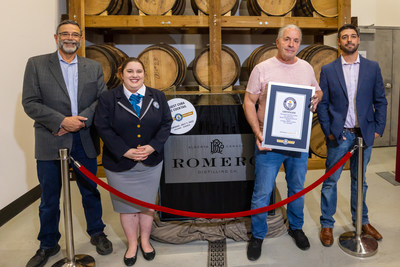 Partner and WWE Hall of Famer, Bret Hart, is joined by Official GUINNESS WORLD RECORDS™ Adjudicator Claire Stevens and Romero co-owners, Tomas and Diego, as they pour the last few ounces into the 1,000-litre cocktail. (CNW Group/Romero Distilling Company)