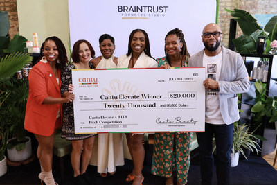 Cantu Elevate grant winner, Ezinne Iroanya, founder and CEO of SKNMUSE, being awarded $20,000