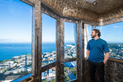 Space Needle employee looks out over Seattle.