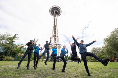 Space Needle employees jump for joy.