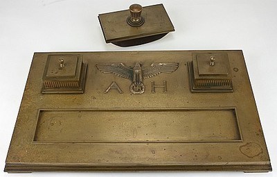 The bronze desk set and blotter used by Adolf Hitler, Neville Chamberlain, and the other signatories to the Munich Pact in 1938 when a portion of Czechoslovakia was ceded to Germany. Chamberlain believed he had obtained "peace in our time." Instead, the agreement only emboldened Hitler, and he invaded Poland a year later, starting World War II. To be offered at auction August 29, 2022 by Alexander Historical Auctions in Maryland.