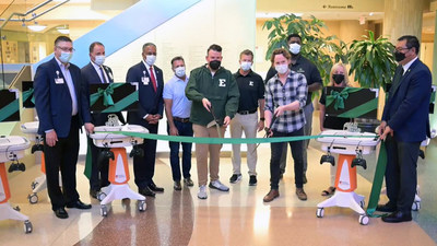 Members from GameAbove provide a generous donation of GO Karts to senior leadership at Trinity Health St. Joseph Mercy Ann Arbor.
