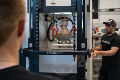 Ty Barzak (left) and Thomas Pomorski (right) remove a 3D-printed copper rocket engine component from the EOS 3D printer at rocket propulsion company Ursa Major’s Advanced Manufacturing Lab in Youngstown, Ohio. Ursa Major will use these components for hotfire testing at its headquarters in Berthoud, Colorado.