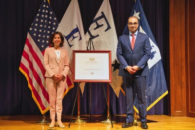 U.S. Secretary of Commerce Gina M. Raimondo presents the President’s “E” Award to Mott Corporation President and CEO, Boris Levin