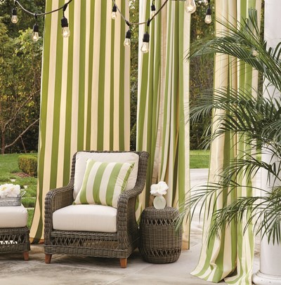 Ballard Designs outdoor curtain panels add a privacy screen for outdoor office working at home.