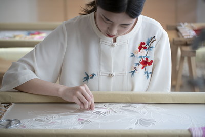 A Taizhou embroiderer is embroidering. (PRNewsfoto/Taizhou Embroidery Museum, Zhejiang Province)