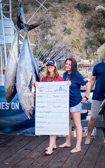 Veterans celebrate their catch during a weigh-in on Avalon’s iconic Green Pleasure Pier at the 2021 WHOW tournament.