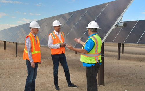 (L-R) Trent McCausland, Vice President of Sustainability and Transparency at Nature’s Sunshine, Terrence Moorehead, CEO of Nature’s Sunshine, and Kevin Garlick, Power Resource Manager at Utah Municipal Power Agency at the solar farm in Mona, UT, which provides renewable energy for the company’s manufacturing facility.
