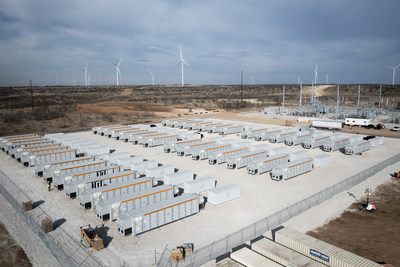 Battery containers and wind turbines visible at Enel's Azure Sky wind + storage project now operating in Throckmorton County, Texas.