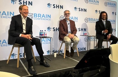 Paul Griffin, Dr. James Mastrianni, and James Christensen onstage at BRAIN