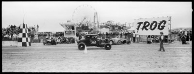 Auto enthusiasts from all over attend T.R.O.G. to race their vintage roadsters, hotrods, and motorcycles down a sandy beach straightaway in front of thousands of spectators.