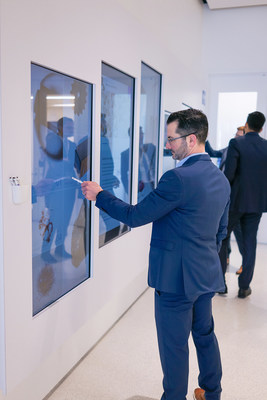 Michael Santilli, Head of Sales for ZEISS Microscopy North America, explores the interactive display wall installed at the ZEISS Microscopy Customer Center in Dublin, CA.