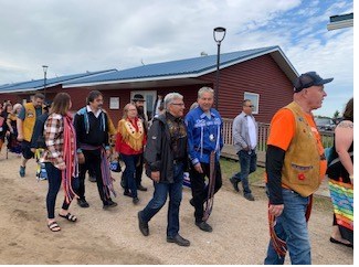 Minister Daniel Vandal and Senator Marty Klyne participate in the Grand Entry.  Credit: Parks Canada (CNW Group/Parks Canada)