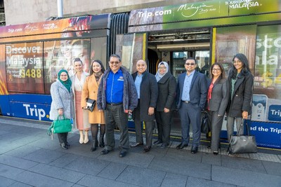 Trip.com and Tourism Malaysia staff, including HE Dato' Roslan Tan Sri Abdul Rahman, The High Commissioner of Malaysia to the Commonwealth of Australia, celebrate the launch of the Discover Malaysia-branded Sydney trams