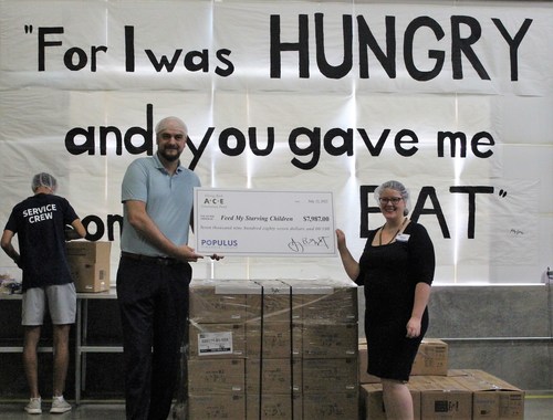ACE Cash Express presents a $7,987 donation to Hillary Coyle, Development Advisor at Feed My Starving Children