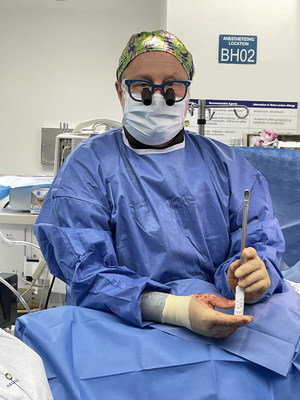 Dr. Anders Cohen performed the first spinal fusion procedure with the new Kleiner Device Labs KG(tm)2 Surge(tm) Flow-Thru Interbody System at the Brooklyn Hospital Center.  Dr. Cohen is shown holding the KG2 just before implantation.  The KG2 combines steps to streamline the implant introduction, positioning and grafting processes in lumbar spinal fusion procedures, and comes as a complete system with the selected size implant pre-attached, in a sterile tear-open pack.