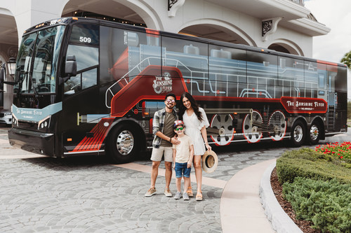 The Sunshine Flyer motorcoach with family.