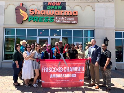 Ambassadors from the Frisco Chamber of Commerce and Shawarma Press employees celebrate the grand opening of the restaurant's newest location at 6363 Dallas Parkway, Suite 107. The Frisco location marks the sixth Shawarma Press quick-service restaurant to operate throughout Texas.