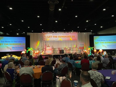 Stage Decoration at Florida Attractions Association Annual Conference 2022, by Zigong Lantern Group, includes a Giant Alligator, Flamingos, Leopard, Peacock, Flowers, and Butterflies