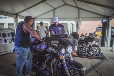A motorcyclist experiencing a live audio demo at the Rockford Fosgate booth during the 2021 Sturgis® Motorcycle Rally™
