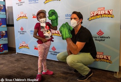 Jakeira “Kiki” Williams, 9, shows off her super hero pose alongside Armen Taylor, the voice of The Hulk on Marvel’s Spidey and His Amazing Friends on Disney Junior. Courtesy of Texas Children's Hospital.