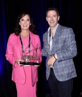 REALM Global Founder and CEO Julie Faupel and Founding Partner Brennan Buckley accept the prestigious Golden I Award for REALM as the Top Luxury Real Estate Standout at a recent industry meeting in Las Vegas.