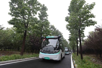 The autonomous bus fleet driving in the mountain park in the Zibo National New & Hi-tech Industrial Development Zone (PRNewsfoto/Information Office of the People's Government of Zibo)