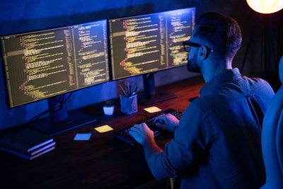 Cybersecurity worker on computer