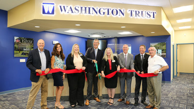 Washington Trust celebrates their newest branch in Cumberland, RI with a ribbon-cutting event. From left, Director of the Northern Rhode Island Food Pantry, Richard Telesmanick; Northern RI Chamber President Liz Catucci; AVP & Branch Manager Crystal Thompson; Washington Trust Chairman & CEO Ned Handy; Executive VP and Chief Retail Banking Officer Deb Gormley; Vice President and Director of Facilities Larry Orlando; Cumberland Mayor Jeffrey Mutter; and President of A. Autiello Construction Co.