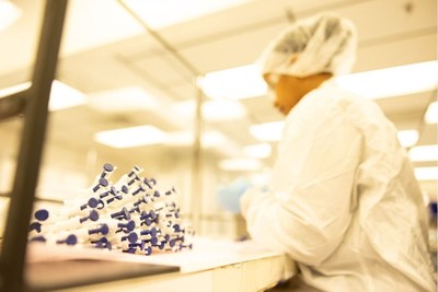 Ranfac Employee Packaging Product for Sterilization within Company's ISO Class 7 Clean Room