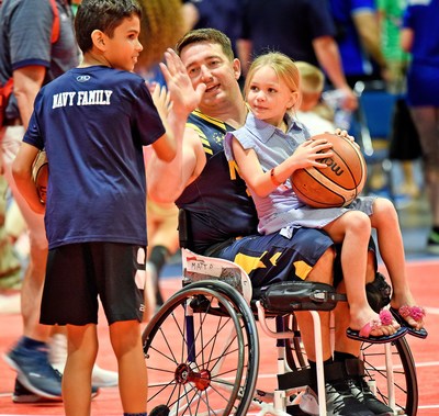Navy family congratulates athlete during the 2019 DoD Warrior Games.