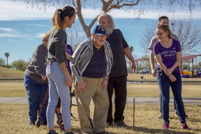 Students from the Grand Canyon University DreamCatchers Chapter in Phoenix, AZ, with Dreamer Clifford during his Dream horseshoes game with friends in the park.