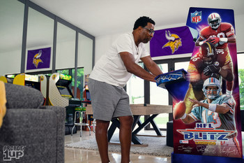 NFL Legend Cris Carter gaming out on Arcade1Up's NFL Blitz Legends arcade machine