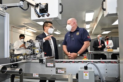 MaximBio COO Jonathan Maa explains ClearDetecttm COVID-19 Antigen Home Test manufacturing process to Maryland Governor Larry Hogan. (photo courtesy of the Office of the Governor)