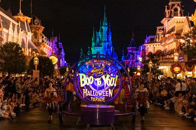 Ghosts and ghouls of all ages line a decorated Main Street, U.S.A for 