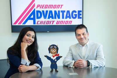 Pictured left to right with Piedmont Advantage Credit Union are Community Development Executive Jobana Semones, youth program mascot Al Pacu and President & CEO Dion Williams.