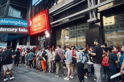 Longtime and new fans of Jollibee line up in anticipation of the Times Square location grand opening.