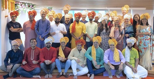 Fictiv's grand opening of its Pune, India office was celebrated by co-founder and CEO Dave Evans (right, back row), other members of Fictiv's executive leadership team and Fictiv Pune employees.
